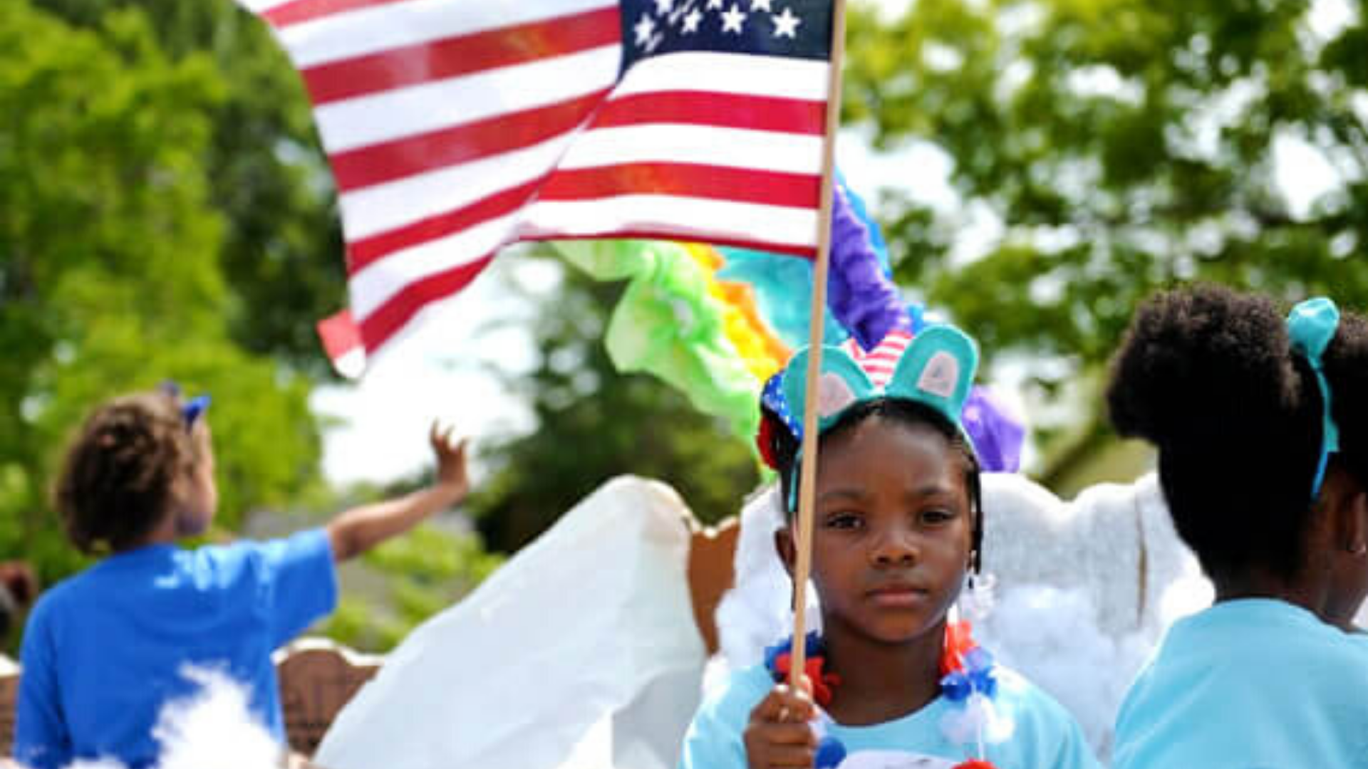 Girl holding a flag at the Port Wentworth Stand up for America Day Festival